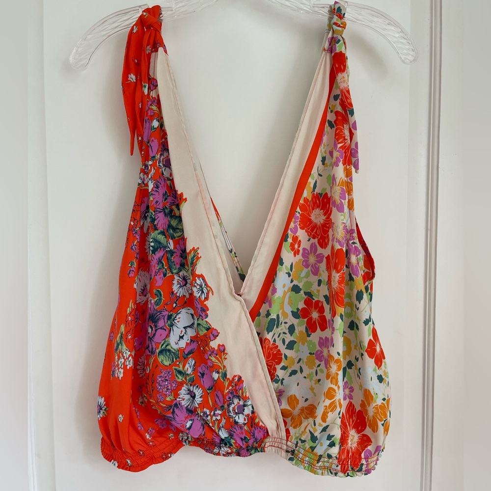 Free people size extra small/medium flowered camisole type top.